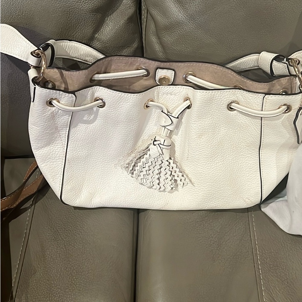 Authentic Cream Leather Coach purse. Only used a couple of times.  Exc Condition